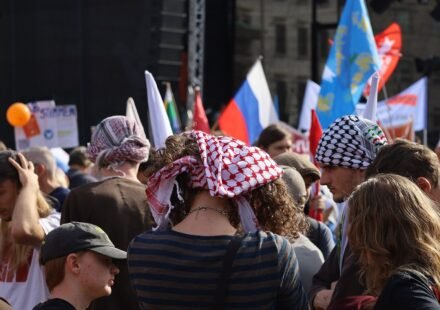 Demonstrators gather near Berlin’s Brandenburg Gate during a public protest.