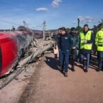 Emergency personnel inspect the scene of a railway accident involving a derailed high-speed train in southern Spain.