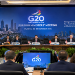 A conference room with international delegates seated around a table during a G20 foreign ministers’ meeting.