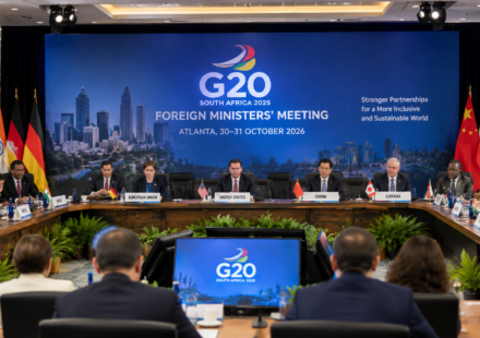 A conference room with international delegates seated around a table during a G20 foreign ministers’ meeting.