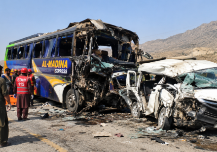 Illustrative image of a severely damaged passenger bus and van after a road collision.