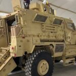 An armoured MRAP vehicle being equipped with additional gunner protection in Port-au-Prince, Haiti, in August 2024.