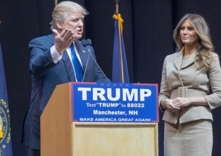 Donald Trump standing with his wife Melania Trump.