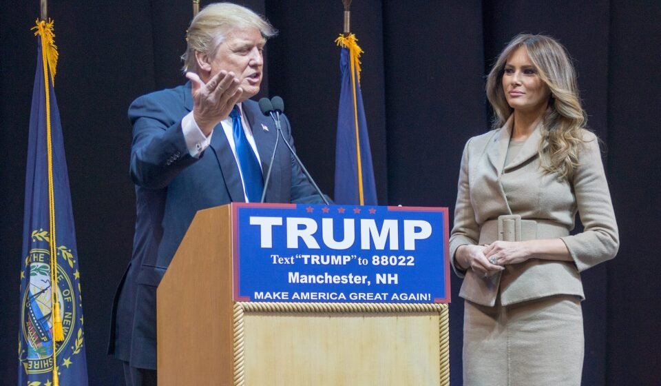 Trump Casts Florida Ballot as Iran War and Campaign Ad Controversy Dominate Midterm Debate Donald Trump standing with his wife Melania Trump.