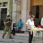 Israeli security forces near a checkpoint outside Hebron following a shooting.