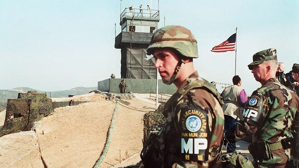 Soldiers and security fencing near the border separating South Korea and North Korea.