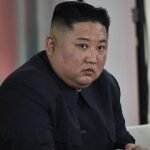 North Korean leader Kim Jong Un at an official event, amid reports of his visit to China.