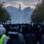 Demonstrators gather amid tear gas at Place de la République in Paris during the October 17, 2026 unrest.