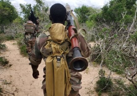 Somali National Army soldier carrying an RPG-7 rifle during counterinsurgency operations.