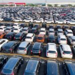 US economic sanctions targeting Iran's automotive and railway sectors amid shipping lane blockade.
