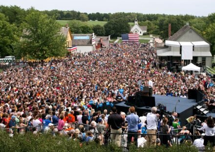Barack Obama speaking at a campaign rally from a lectern.